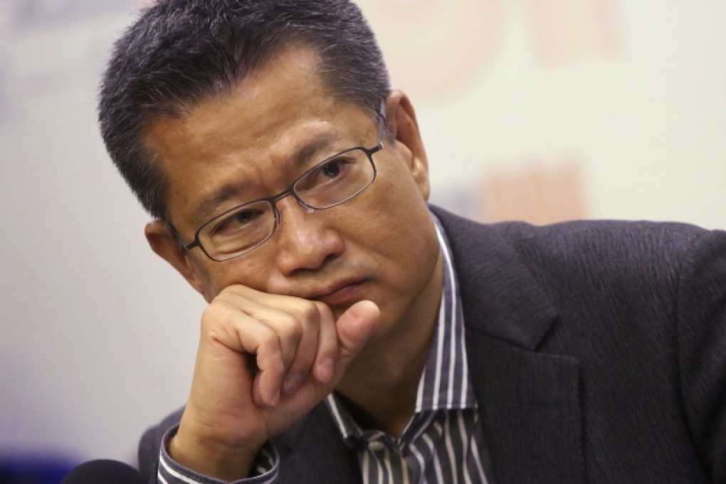Secretary for Development Paul Chan Mo-po attends a online programme at Commercial Radio in Kowloon Tong. Photo: Sam Tsang