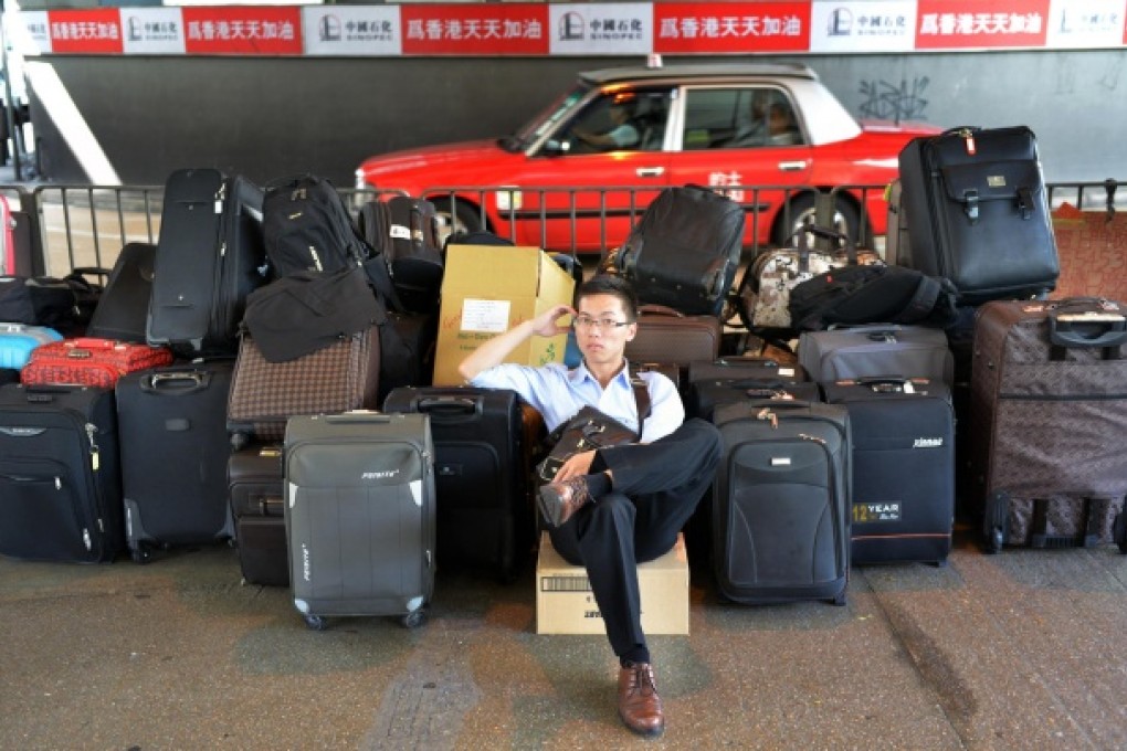 The bags may look full but mainlanders are finding extra space to pack away some life insurance while visiting Hong Kong. Photo: Thomas Yau