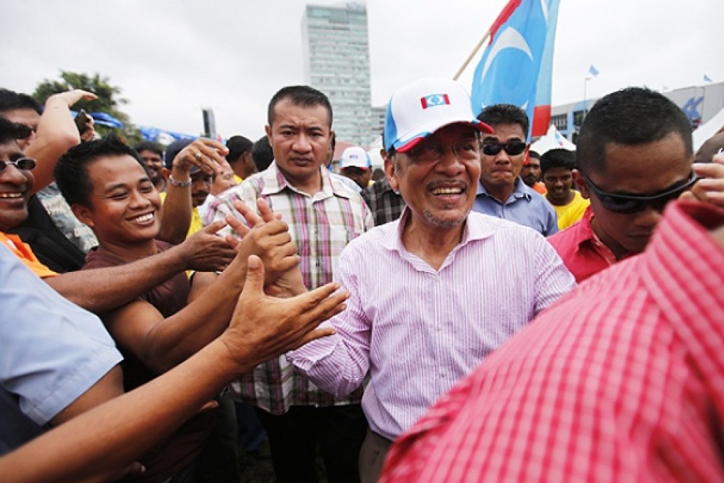 Malaysia's opposition leader Anwar Ibrahim is greeted by supporters in Kuala Lumpur. Photo: Reuters