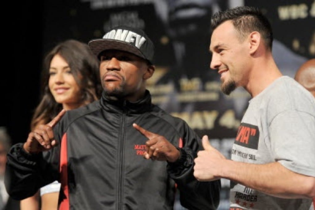 Boxers Floyd Mayweather Jr. (L) and Robert Guerrero pose during the final news conference for their bout at the MGM Grand Hotel/Casino in Las Vegas. Photo: AFP