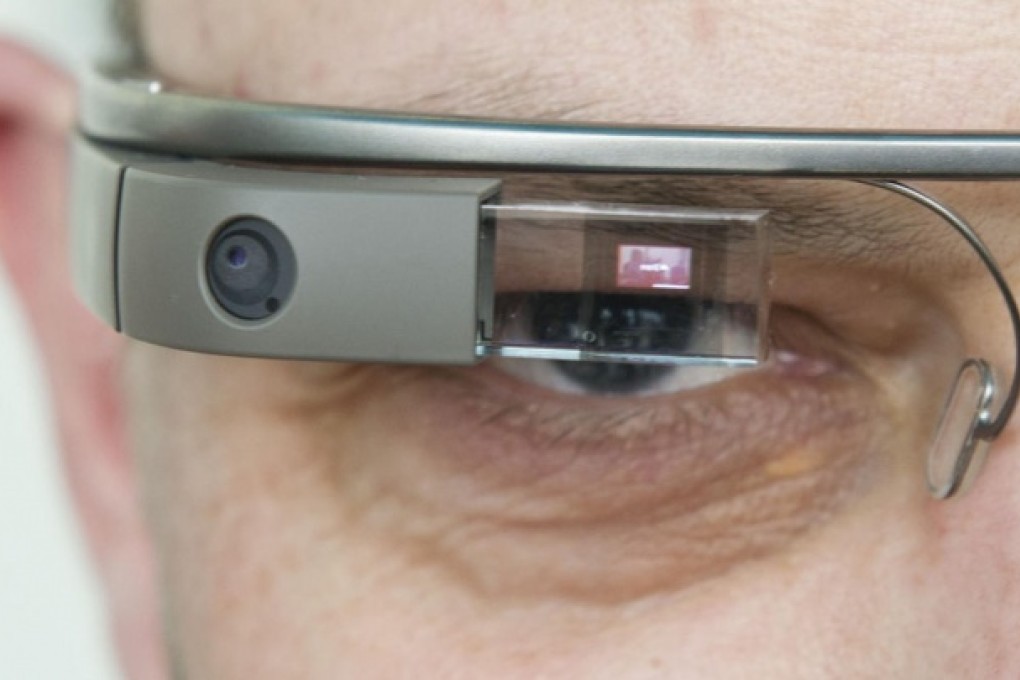 Programmer Jay Freeman says that even door codes and what a Glass wearer writes could be seen by a hacker.Photo: AFP
