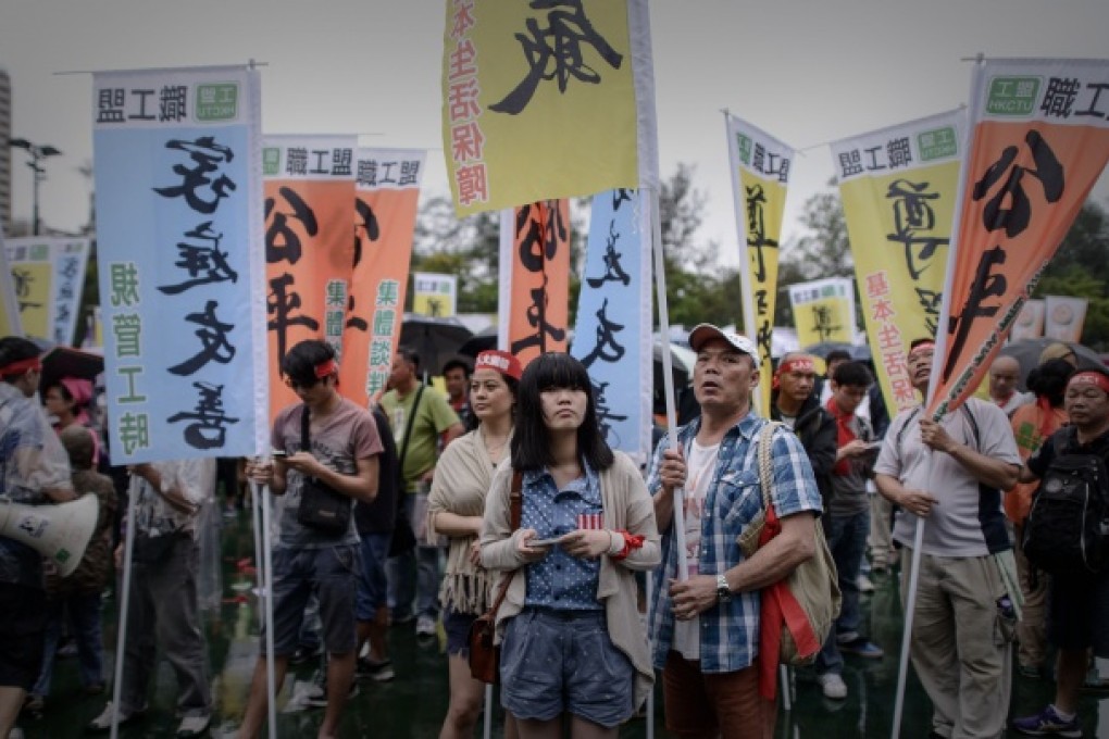 Workers take part in a Labour Day rally in Hong Kong on May 1, 2013. Photo: AFP