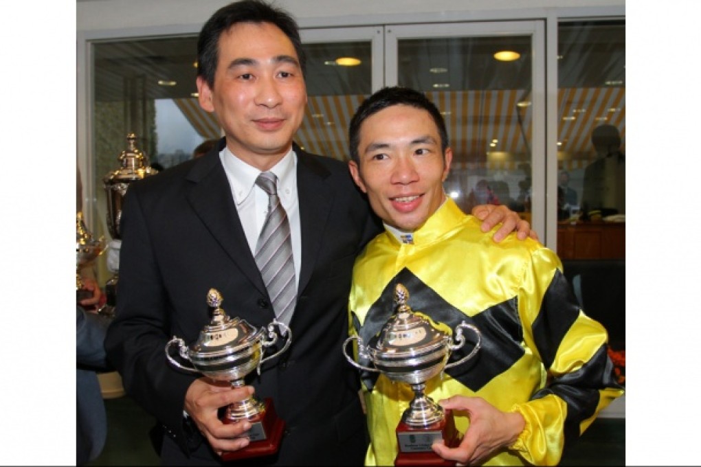 Michael Chang and Howard Cheng show off their silverware.