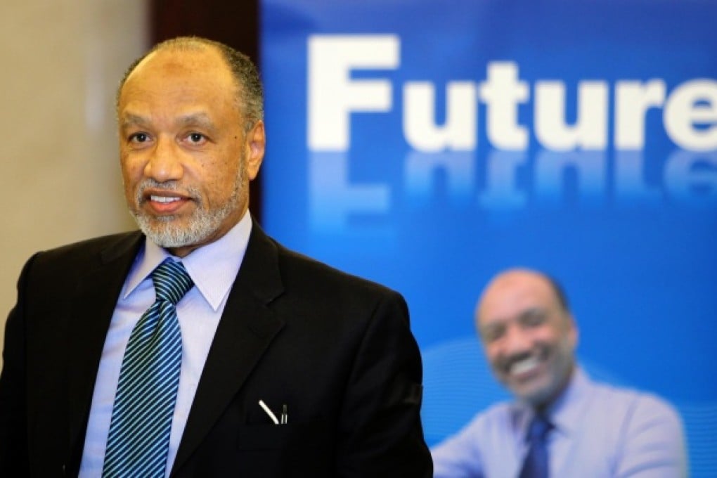 Former president of the Asian Football Confederation Mohamed Bin Hammam reacts at a press conference in Beijing. Photo: Xinhua