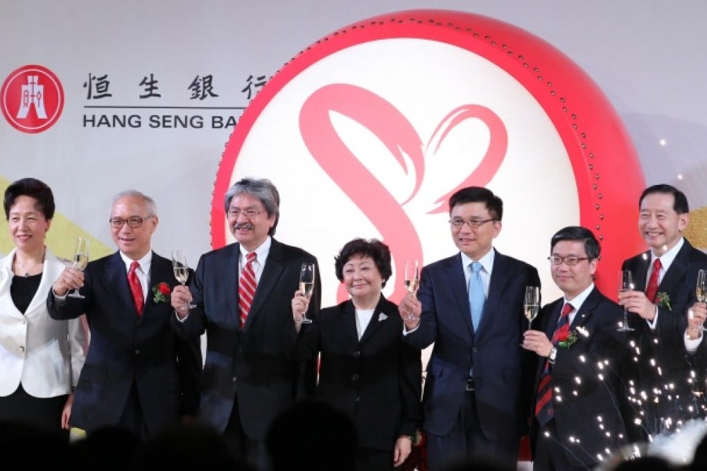 Financial Secretary John Tsang, third from left, raises a toast to Hang Seng Bank at its anniversary reception. Photo: Nora Tam