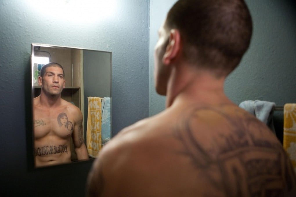 Jon Bernthal (above) outshines lead actor Dwayne "The Rock" Johnson (below right), who struggles to convey vulnerability in this drug drama.