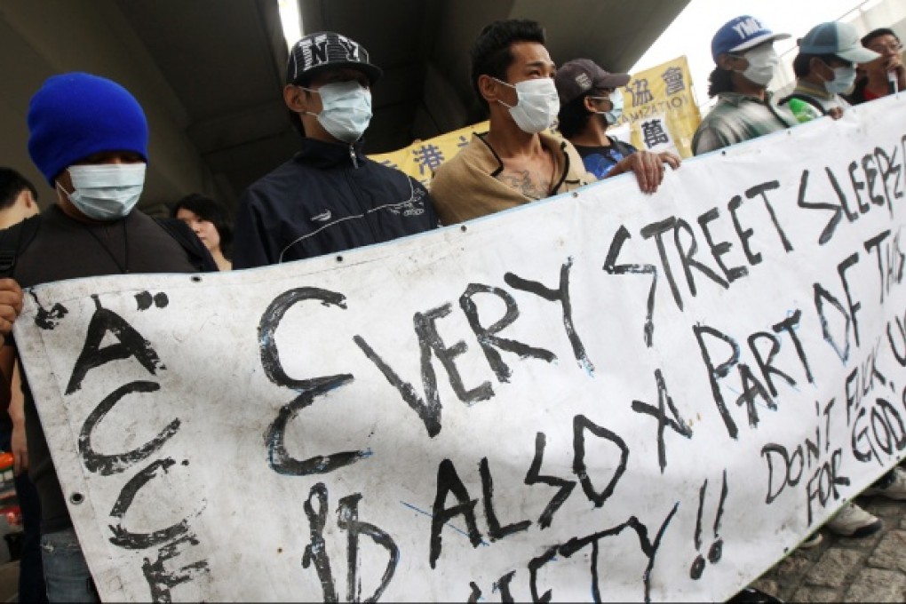 Street sleepers and their supporters protest against being evicted to make way for greening works under the Ferry Street flyover. Photo: David Wong