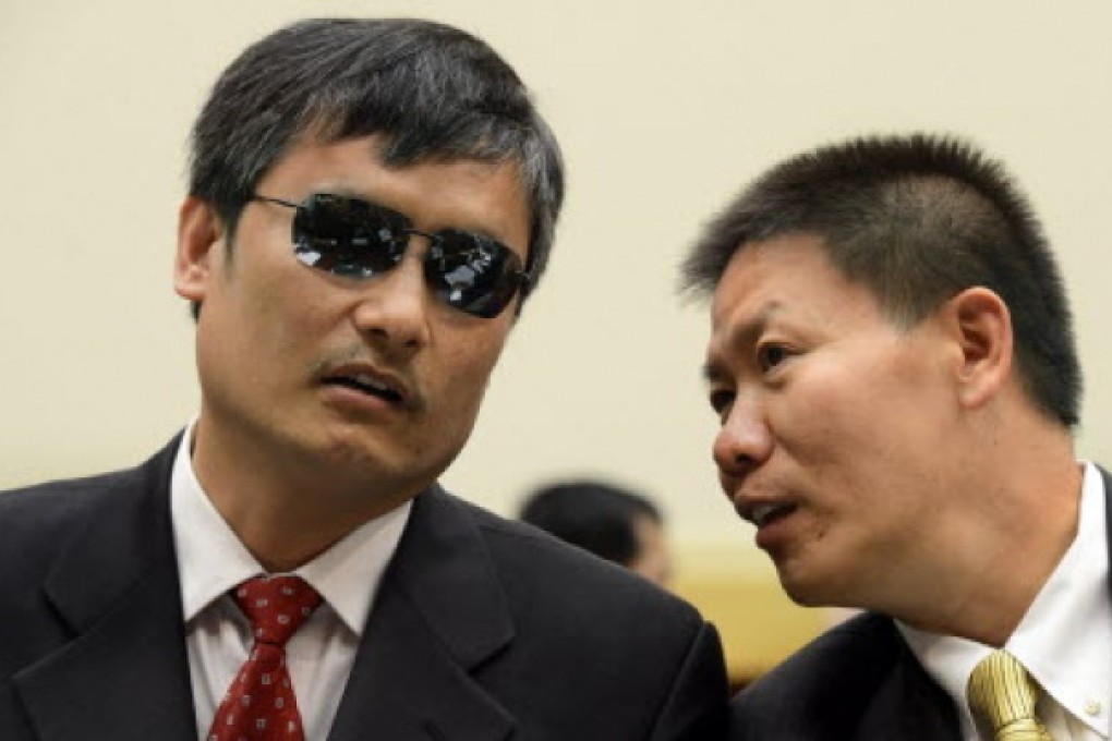 Chinese dissident and human rights activist Chen Guangcheng (L) speaks with Bob Fu (R), founder and president of ChinaAid Association. Photo: EPA