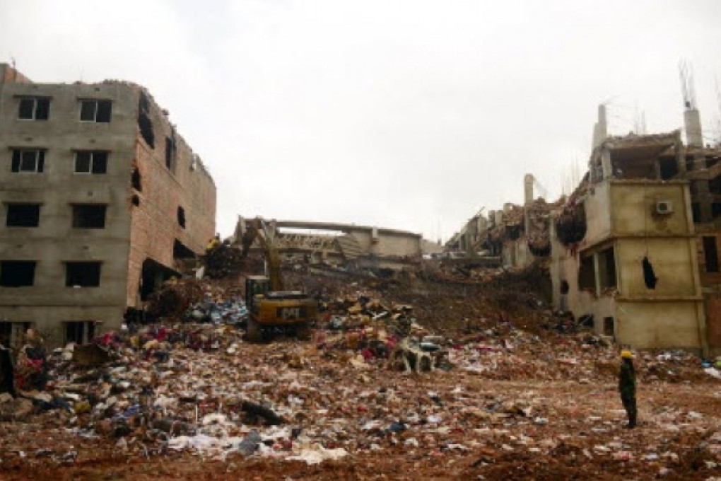 Excavators clear debris as rescue and army personnel continue recovery operations at the site of the eight-storey building collapse in Savar, on the outskirts of Dhaka, on Saturday. Photo: AFP