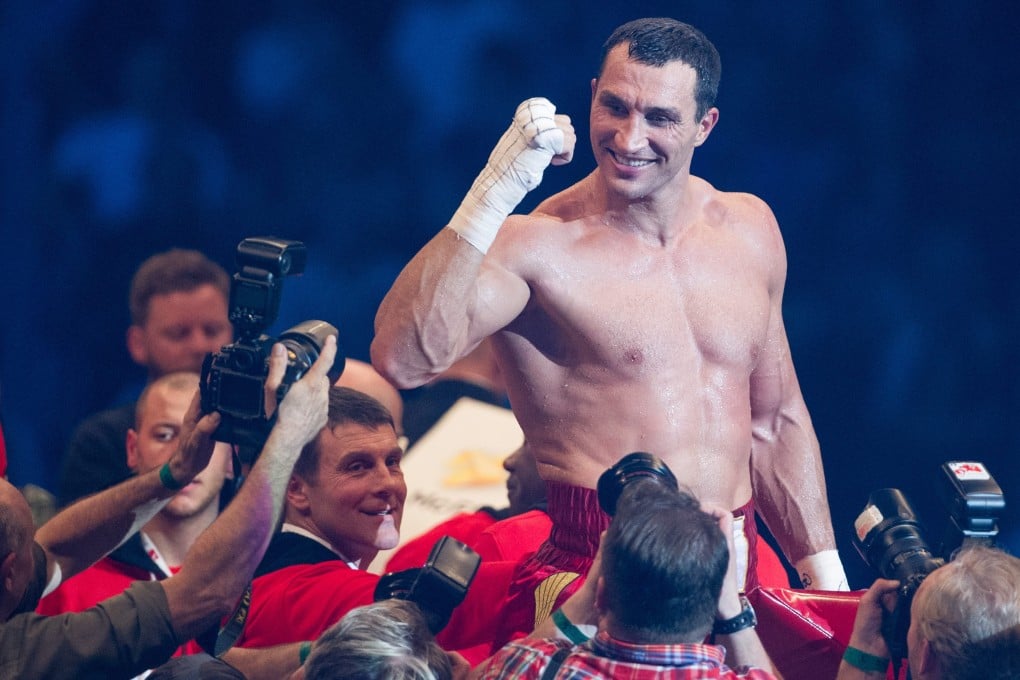Ukrainian boxer Wladimir Klitschko celabrates his victory over German-Italian challenger Francesco Pianeta. Photo: EPA