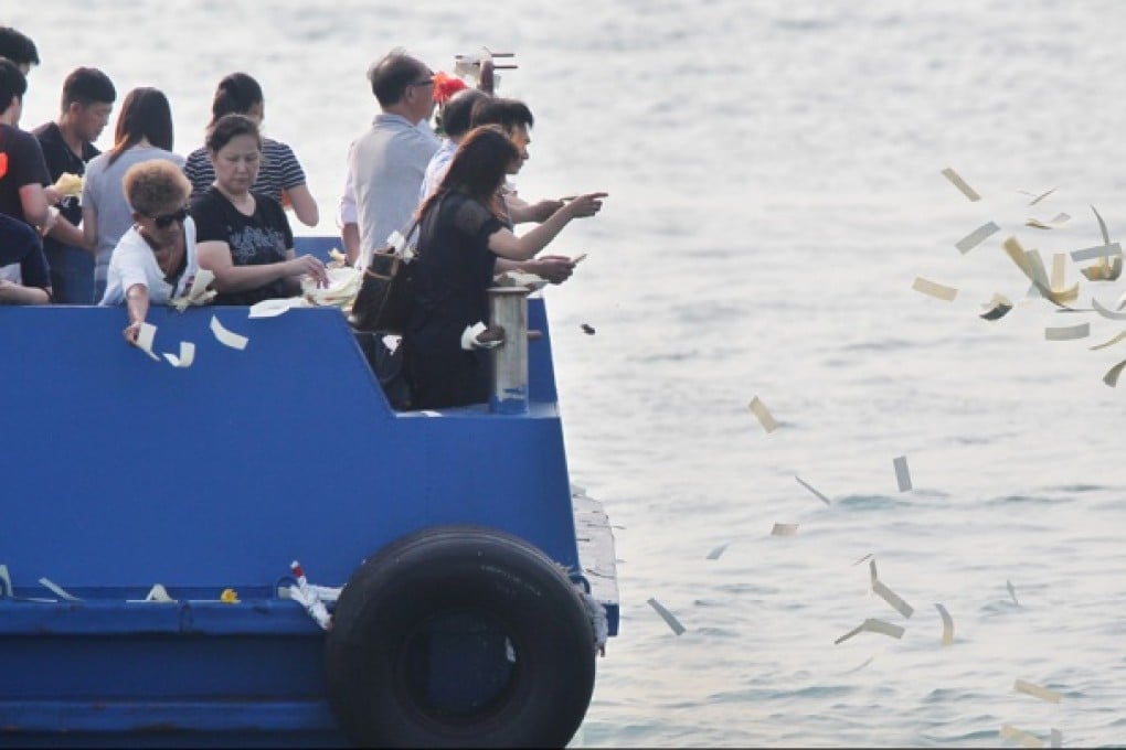 Family members and relatives attend a Taoist ceremony to mourn the Lamma ferry disaster victims. Photo: Nora Tam