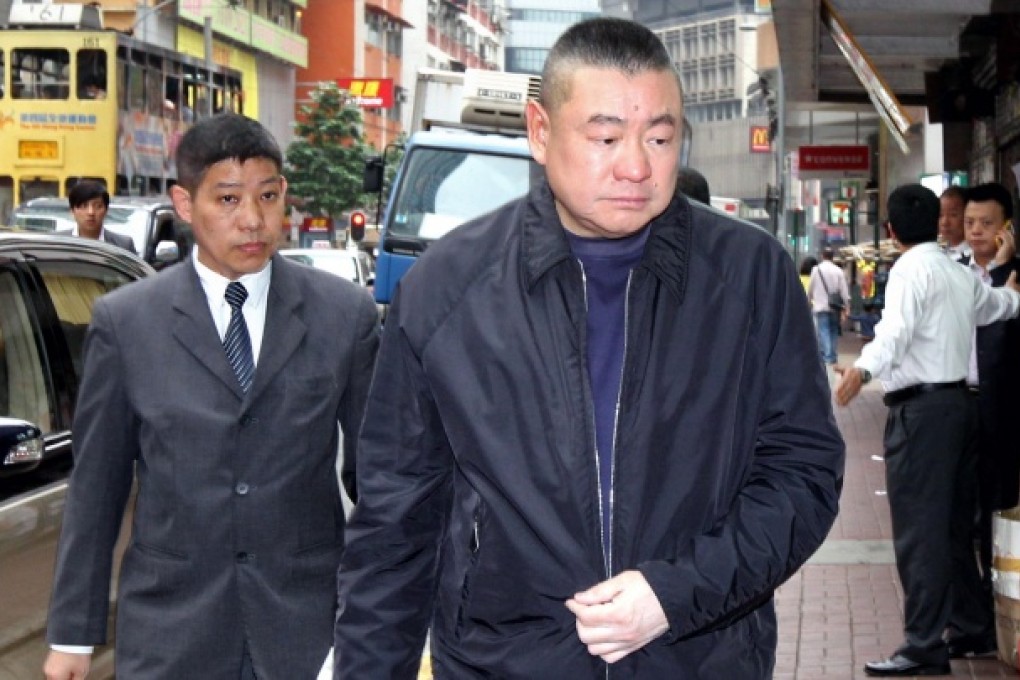 Joseph Lau (right), whose medical report was run in a Chinese newspaper last week, outside a city restaurant yesterday.Photo: David Wong