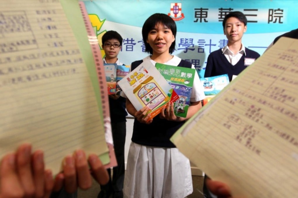 (From left) Pupils Gary Lau Chun-ting, Ng Nga-ki, Cheng Wai-ho are planning to recycle their textbooks. Photo: Felix Wong