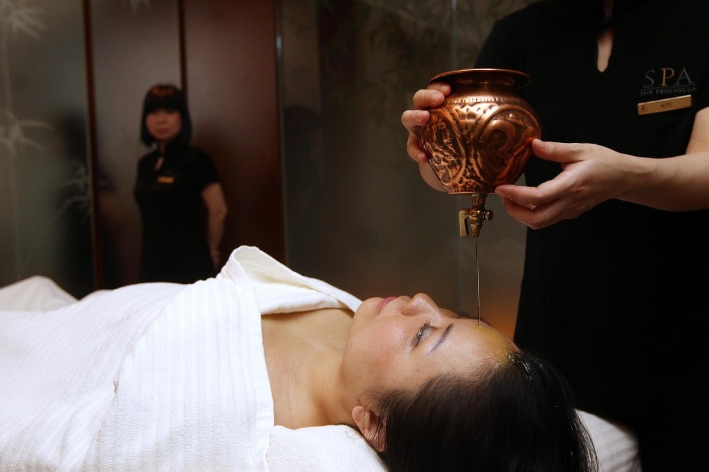 Ayurvedic therapy session at the Peninsula Spa. Photo: Jonathan Wong