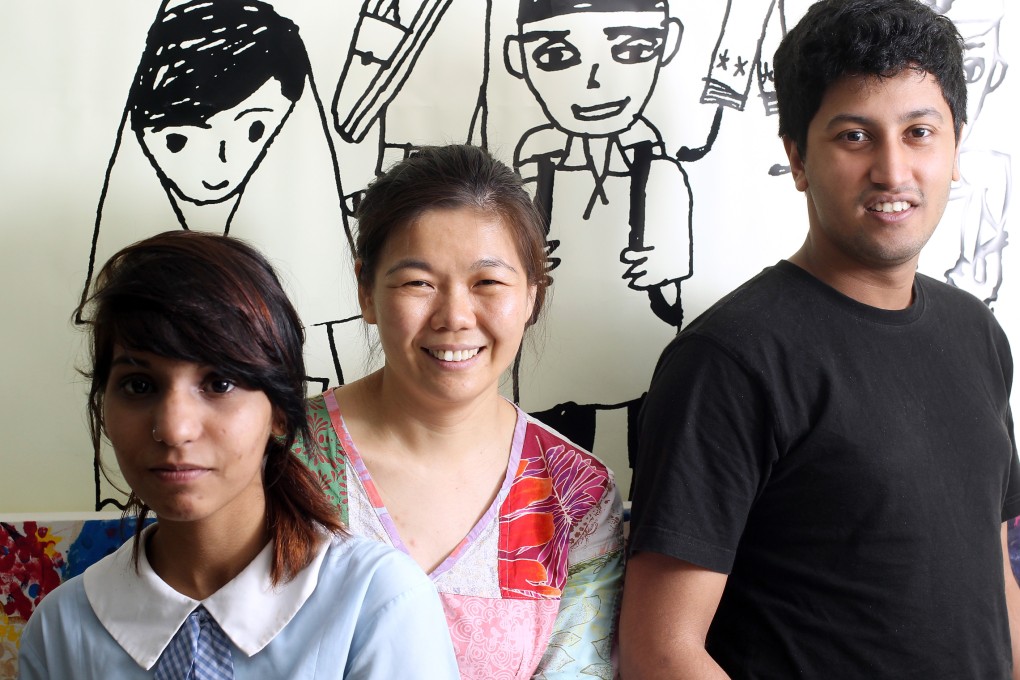 Equal opportunities campaigner Fermi Wong is flanked by students Igra Khan (far left) and Thas Mohamed. Photo: K.Y. Cheng