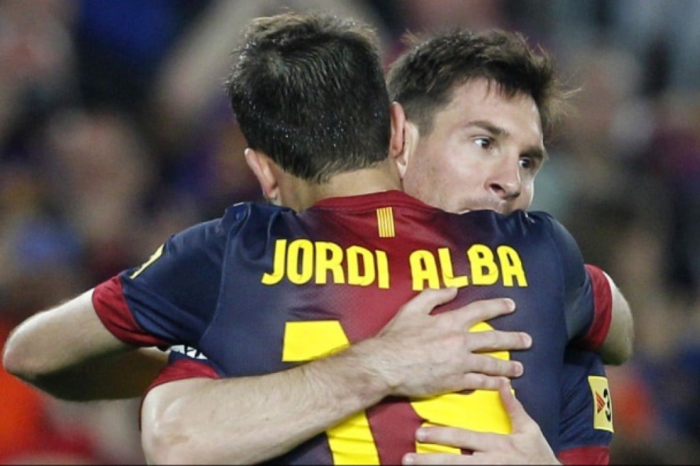 Lionel Messi and Jordi Alba celebrate a goal. Photo: Reuters