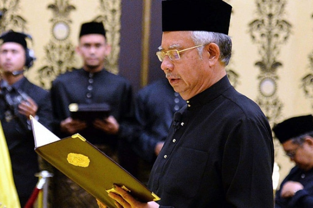 Malaysian Prime Minister Najib Razak is sworn in. Photo: EPA