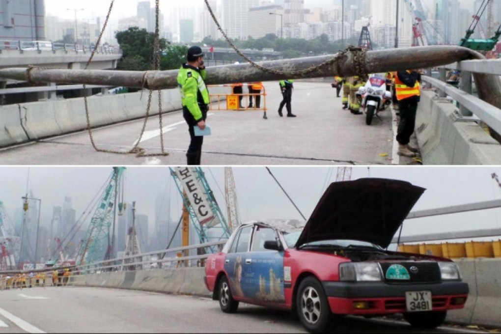 A chain securing the 12-metre pipe to a crane snapped and it crushed a taxi on the busy Island Eastern Corridor. Photos: SCMP