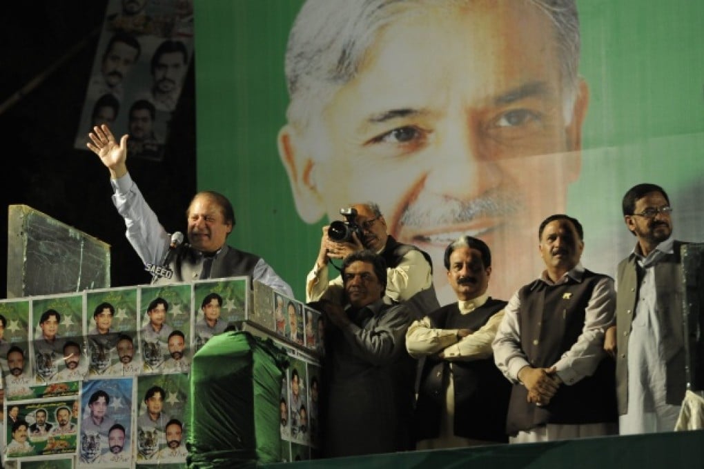 Prime Minister and head of Pakistan Muslim League Nawaz Nawaz Sharif (left) speaks to supporters during an election campaign in Liaquat Bagh. Photo: EPA