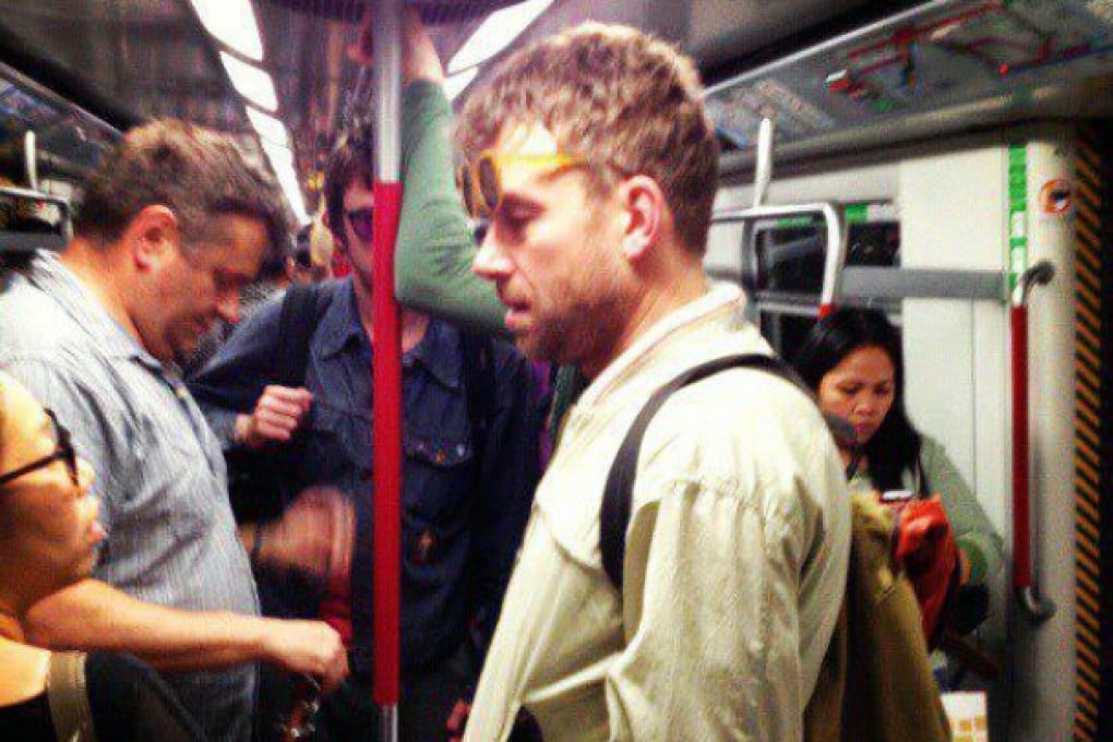 Damon Albarn is spotted on the MTR. Graham Coxon can be seen in the background in purple glasses. Photo courtesy of Marian Joy Hernandez