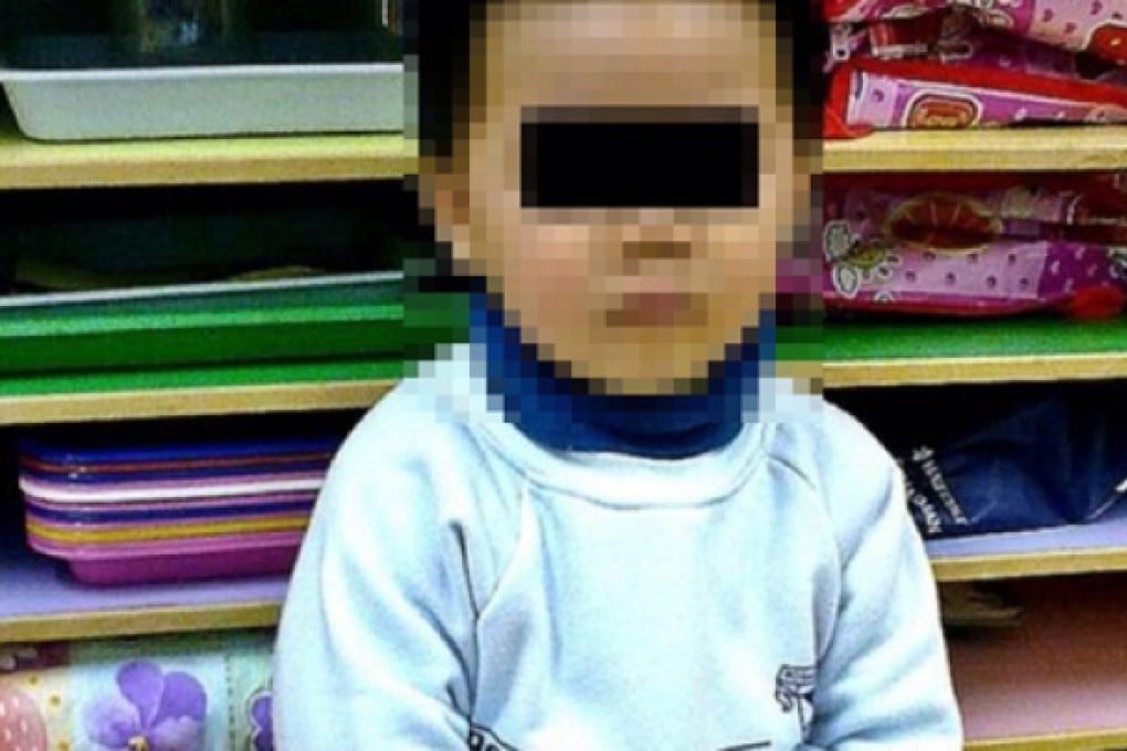 Police probe picture of kindergarten pupil with his hands tied together