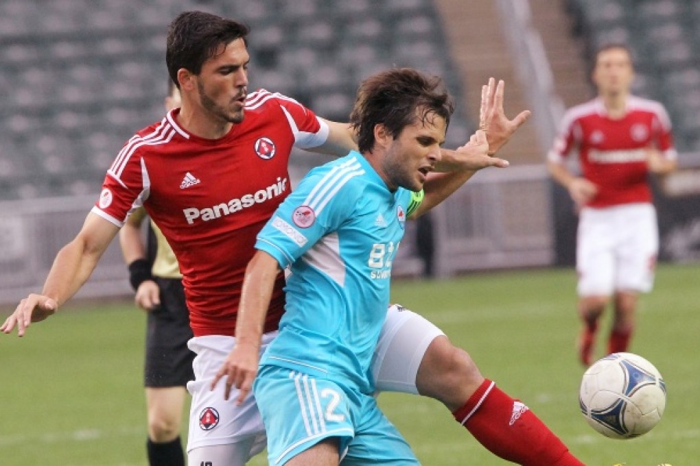 South China team's Padovani Celin Alessandro (left) and Sunray Cave JC Sun Hei team's Affonso Junior Roberto Orlando (Right) in action during First Divison soccer match. Photo: Edward Wong