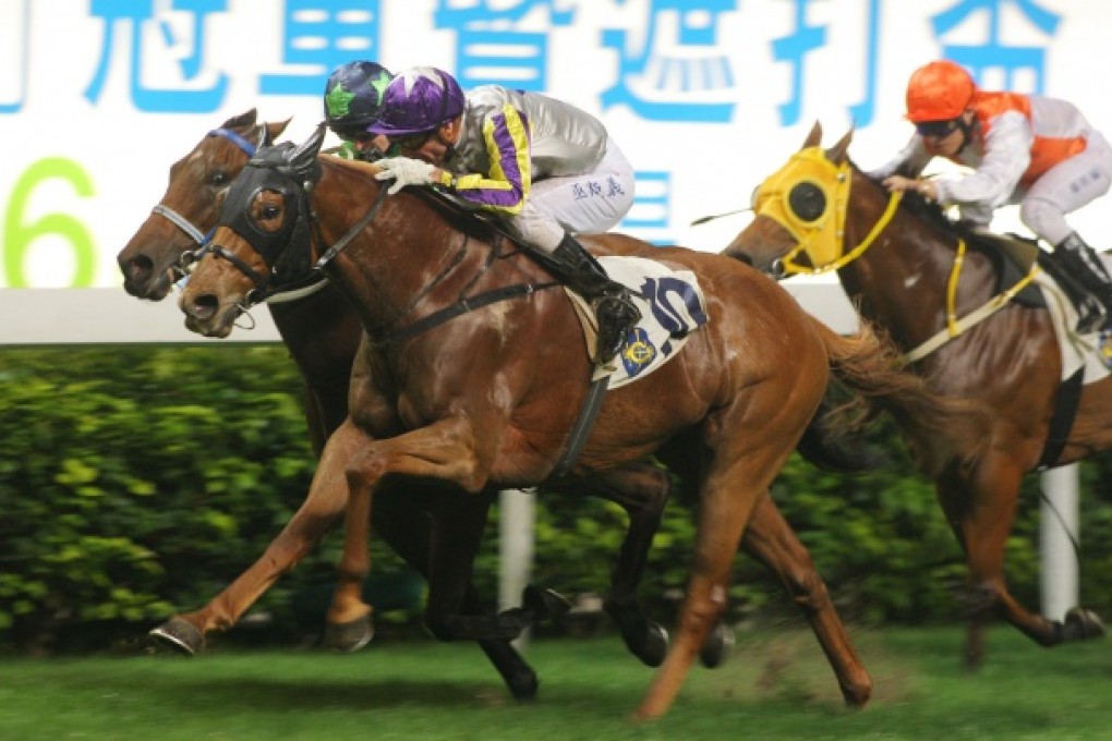 Gerald Mosse scores on Just Good in the second race, the first leg of a double at a wet Happy Valley last night. Photo: Kenneth Chan