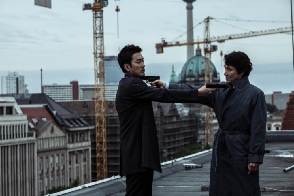 Ha Jung-woo (left) and Han Suk-kyu stand off in The Berlin File, directed by Ryoo Seung-wan. Photo: nathankimphoto