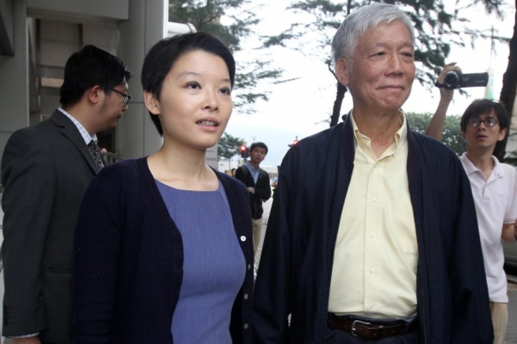 Trainee solicitor Melody Chan leaves Eastern Court with movement organiser Reverend Chu Yiu-ming after hearing her charges yesterday. Photo: David Wong