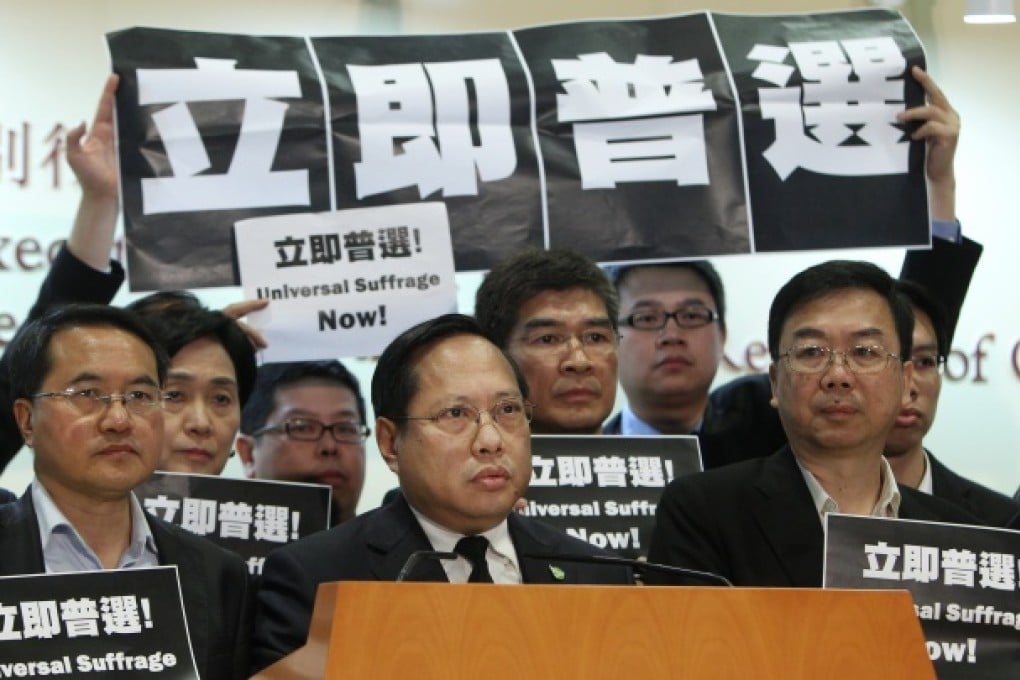 Chief Executive candidate Albert Ho Chun-yan (centre) speaks to the press after losing in the Chief Executive election in Hong Kong Convention and Exhibition Centre. Photo: Sam Tsang