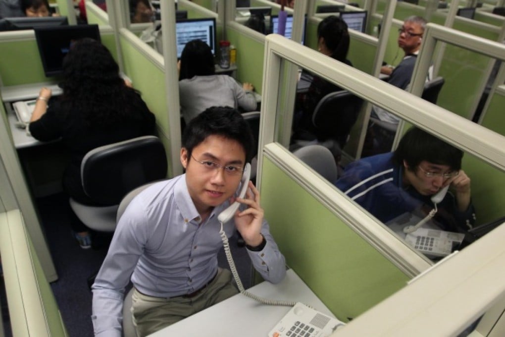 Shawn Mui Pak-ho mans the phones for the HKU's public opinion programme. Photo: May Tse