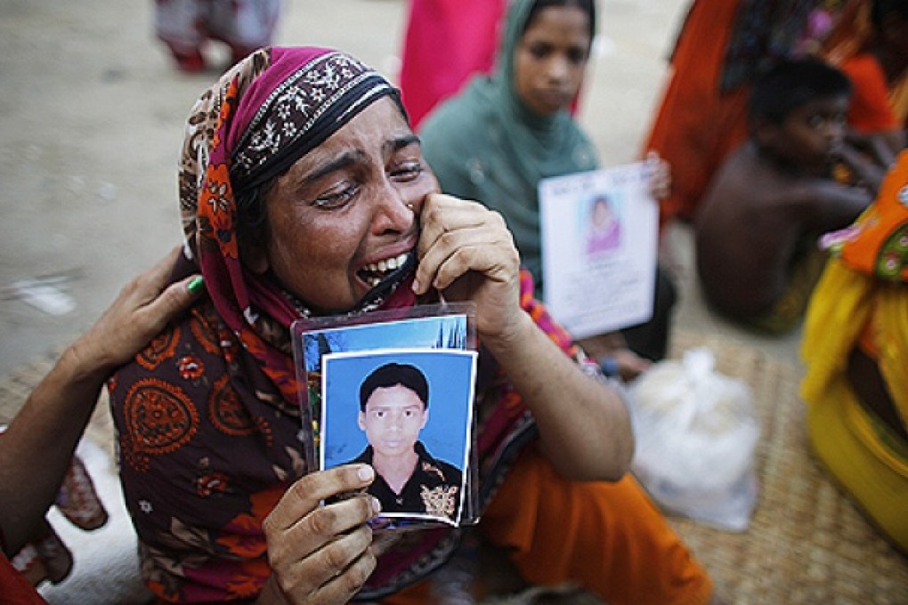 A woman cries as she waits for news of her relative, a garment worker who is still missing, after the collapse of the Rana Plaza building in Savar, outside Dhaka. Photo: Reuters