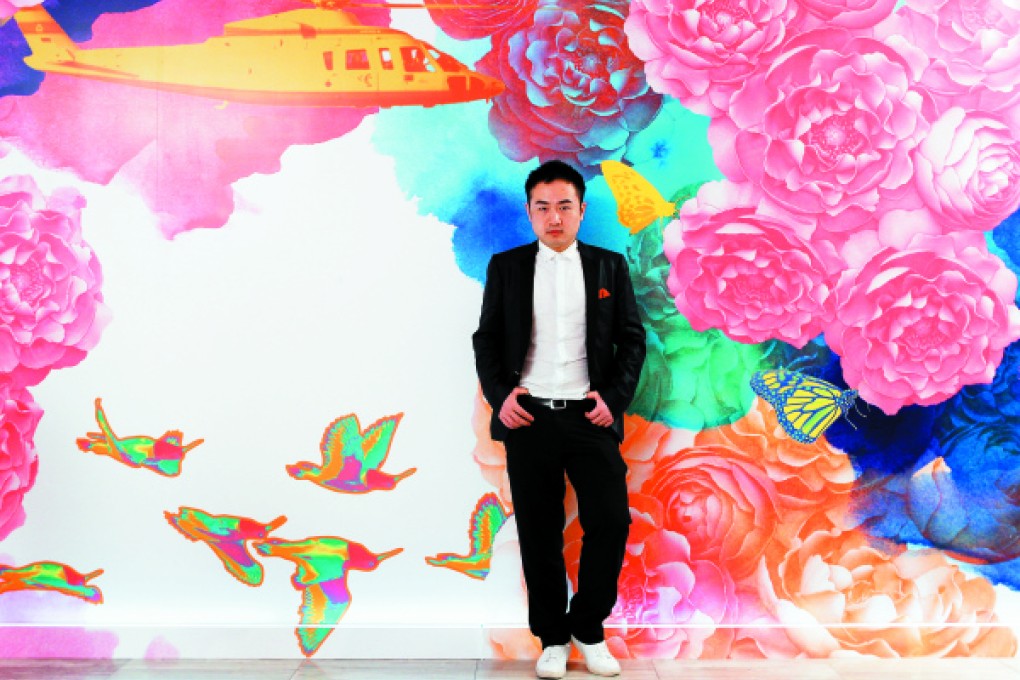 Tsai poses with one of his digital collages. Photo: Edward Wong