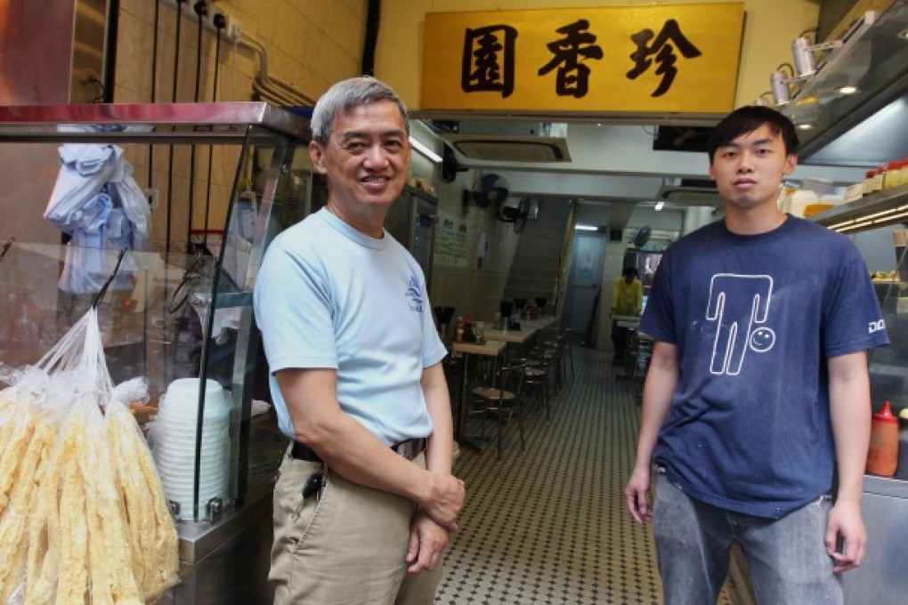 Bill Chan with his son Jonathan (right) wants to keep up food quality. Photo: May Tse