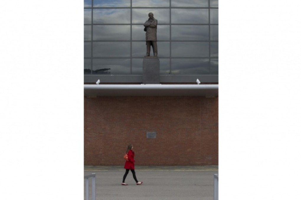 Alex Ferguson's statue at Old Trafford, as permanent as his achievements. Photo: AP