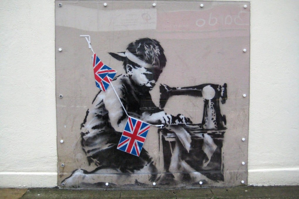 Slave Labour by British graffiti artist Banksy. Photo: EPA