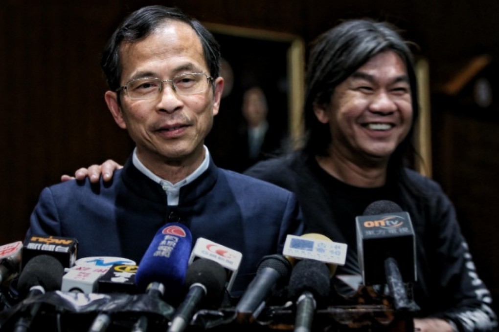 Jasper Tsang receives a pat on the shoulder from "Long Hair" Leung Kwok-hung after announcing his filibuster decision. Photo: Sam Tsang