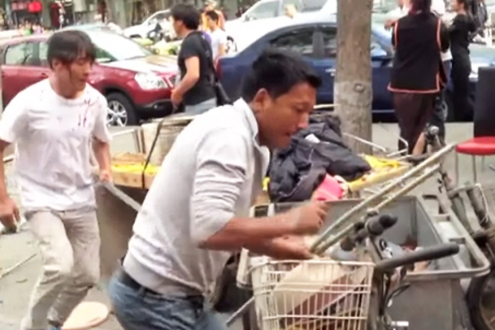 Ai Weiwei shares video of Beijing street brawl 'between Chinese and Tibetans'