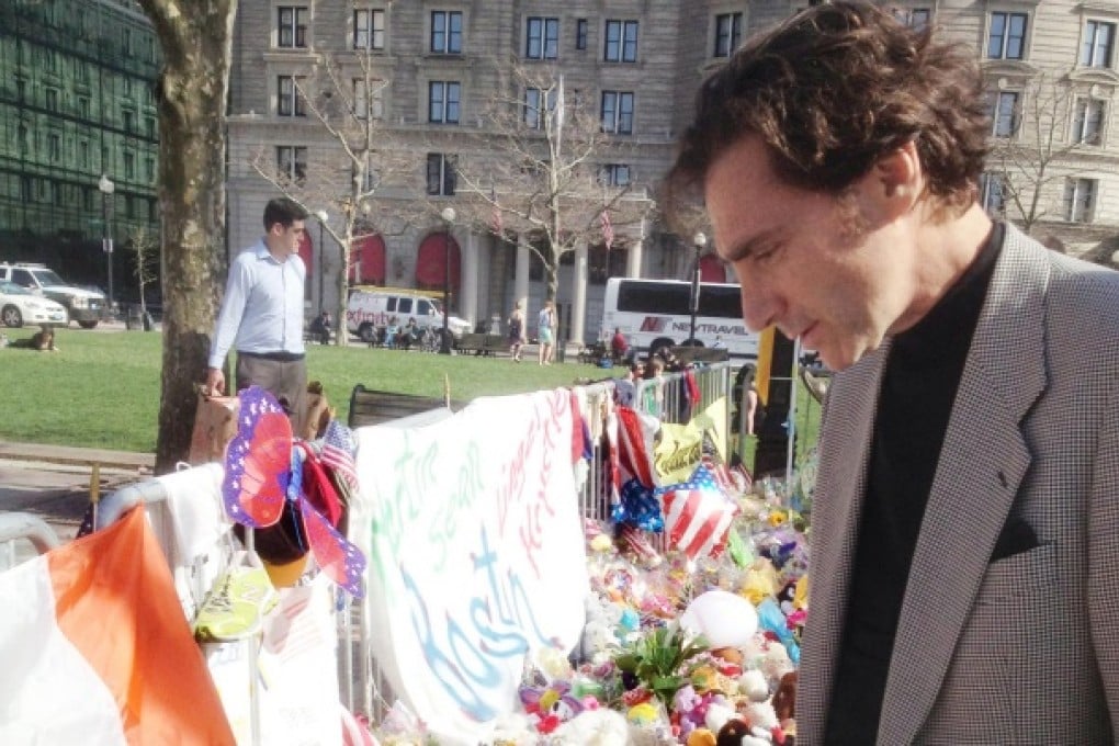 Smolar visiting a memorial for victims. Photo: Brad Smolar