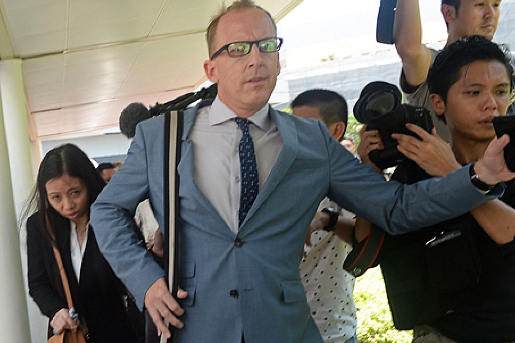 Former girlfriend Shirley Samiento (left) and neighbour Michael William Goodwin of Shane Todd leave court in Singapore. Photo: AFP