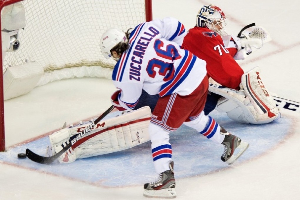 Rangers winger Mats Zuccarello scores against Capitals goalie Braden Holtby in the third period of game seven. Photo: MCT