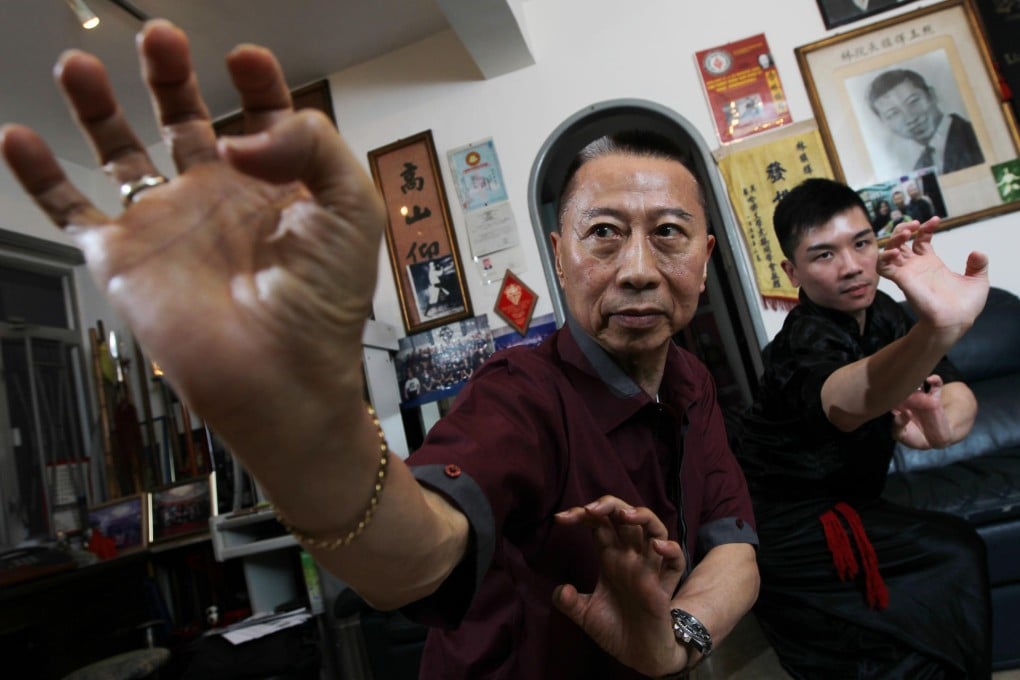 Hung Kuen master Lam Chun-fai, 73, and his son Oscar Lam Chuen-ho, 28, demonstrate their craft. Photo: Felix Wong