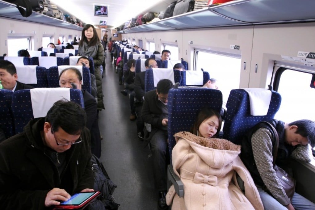 Passengers on the first high-speed rail train from Guangzhou to Beijing. Photo: Simon Song