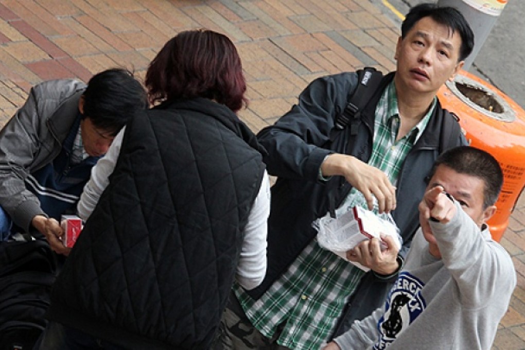 Cheng Shing-wing (top right) and Li Hak (bottom right) before assaulting SCMP photographer May Tse near Sheung Shui MTR station in February. Photo: May Tse