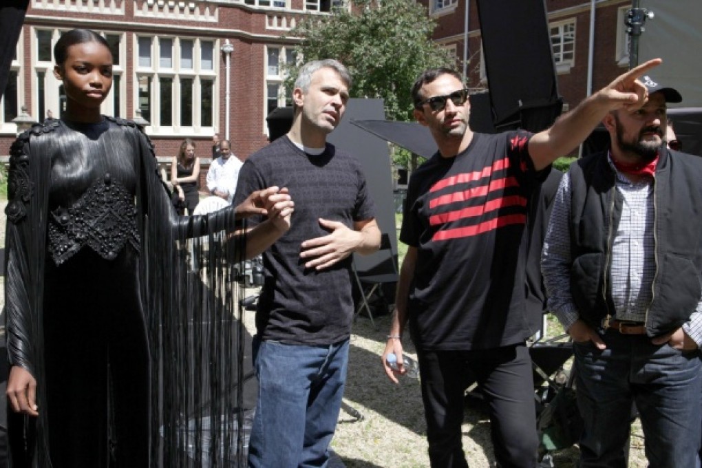 Riccardo Tisci (second from right) directs a model in a shoot for Givenchy's autumn-winter 2013 haute-couture collection. Photos: Corbis