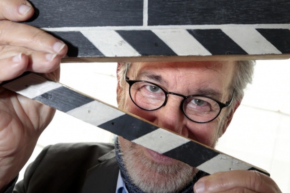 Steven Spielberg, president of the 66th Cannes Film Festival, with a director's clap on the eve of the film extravaganza. Photo: Reuters