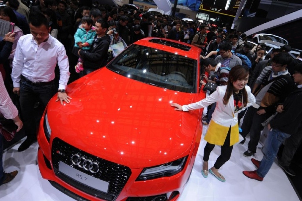 An Audi RS7 gets plenty of attention at the Shanghai car show last month. Audi's China sales rose 13 per cent for the month. Photo: AFP