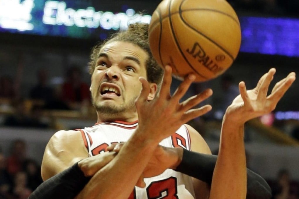 The Chicago Bulls' Joakim Noah is fouled by the Miami Heat's Dwyane Wade during game four of their conference semi-final. Photo: AP