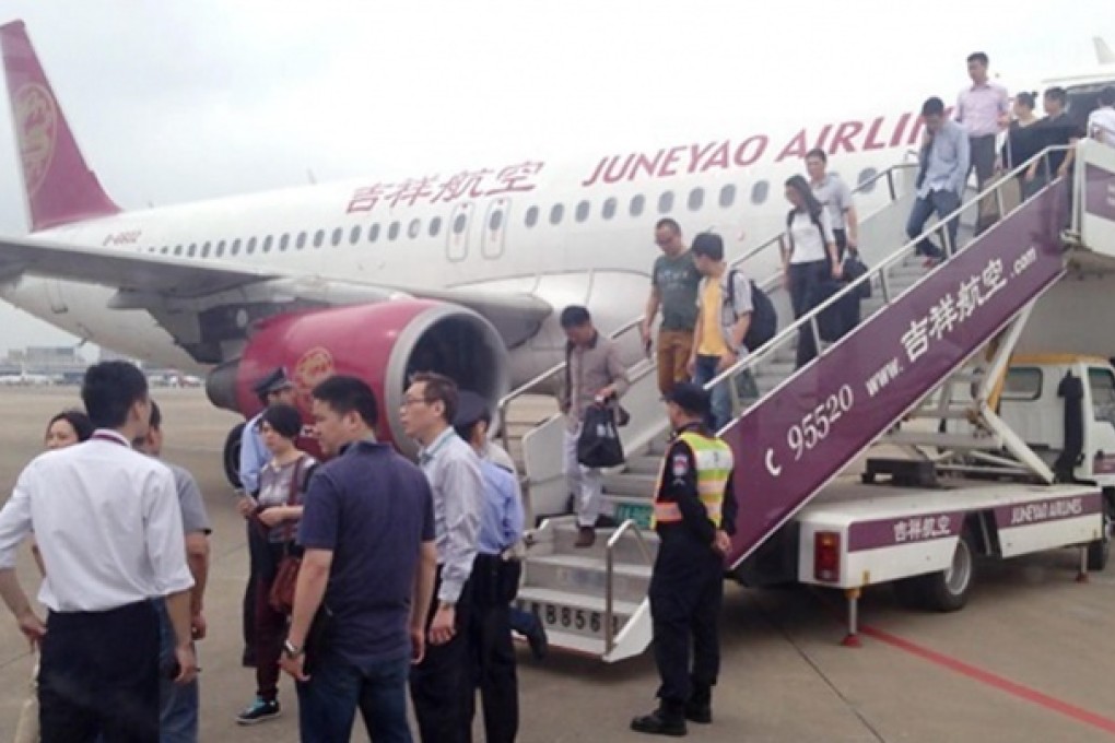 This Juneyao Airlines plane made an emergency landing following terror threats. Photo: SCMP Pictures
