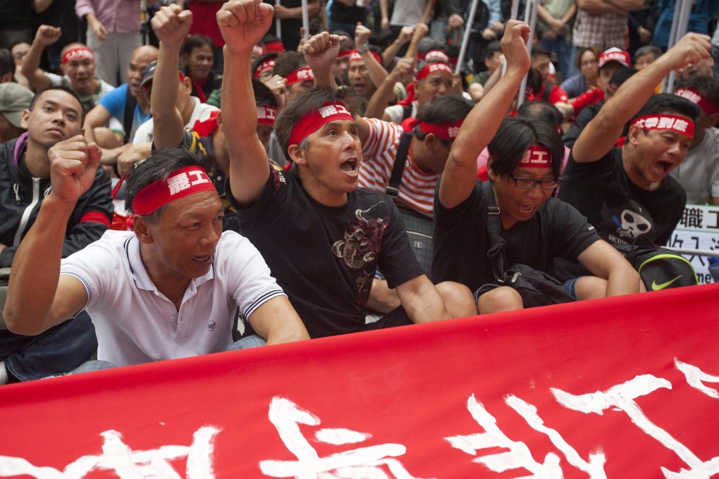 The striking dockers protest in Admiralty on May Day. Photo: EPA